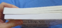 Book thickness shows that the paper is thinnger for the lower quality color version